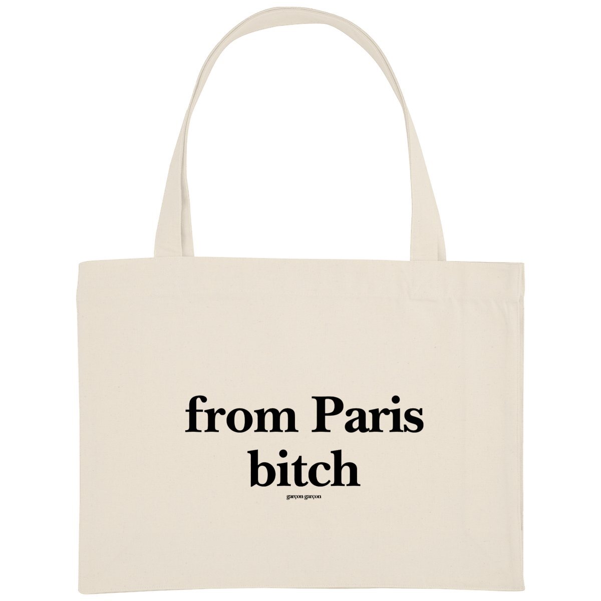 from Paris Bitch totebag. An eco-friendly cream-colored tote bag featuring the bold statement 'from Paris Bitch' in black typography, with the brand name 'garçon garçon' subtly placed underneath. A modern accessory that carries more than just your essentials—it carries a message of love and equality.